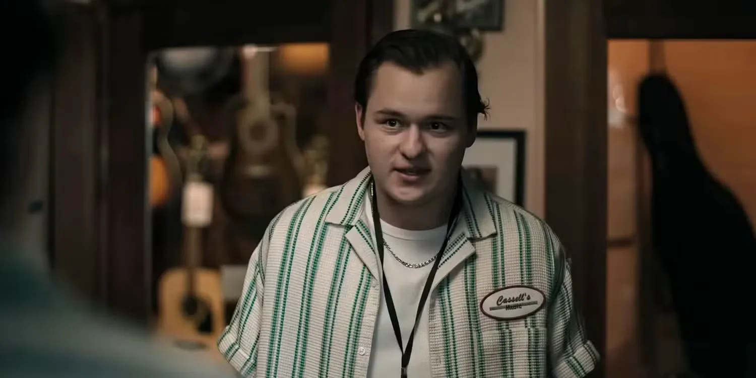 Cooper Tomlinson as Ian in his work outfit at the music store in Obsession