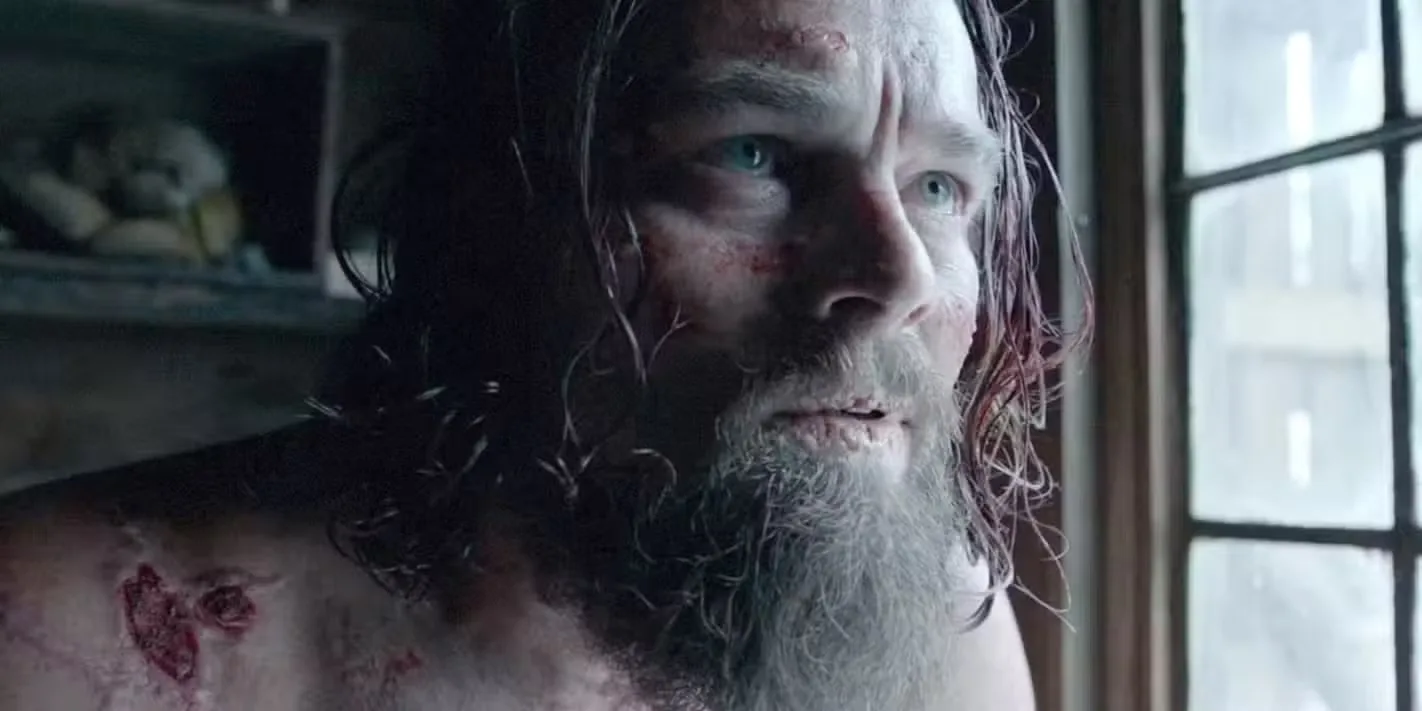 Leonardo DiCaprio sitting in a house after his brutal survival in The Revenant. 