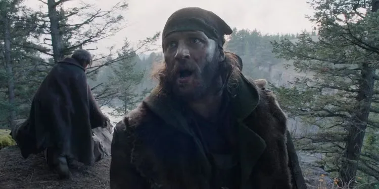 Tom Hardy talking in the woods in The Revenant