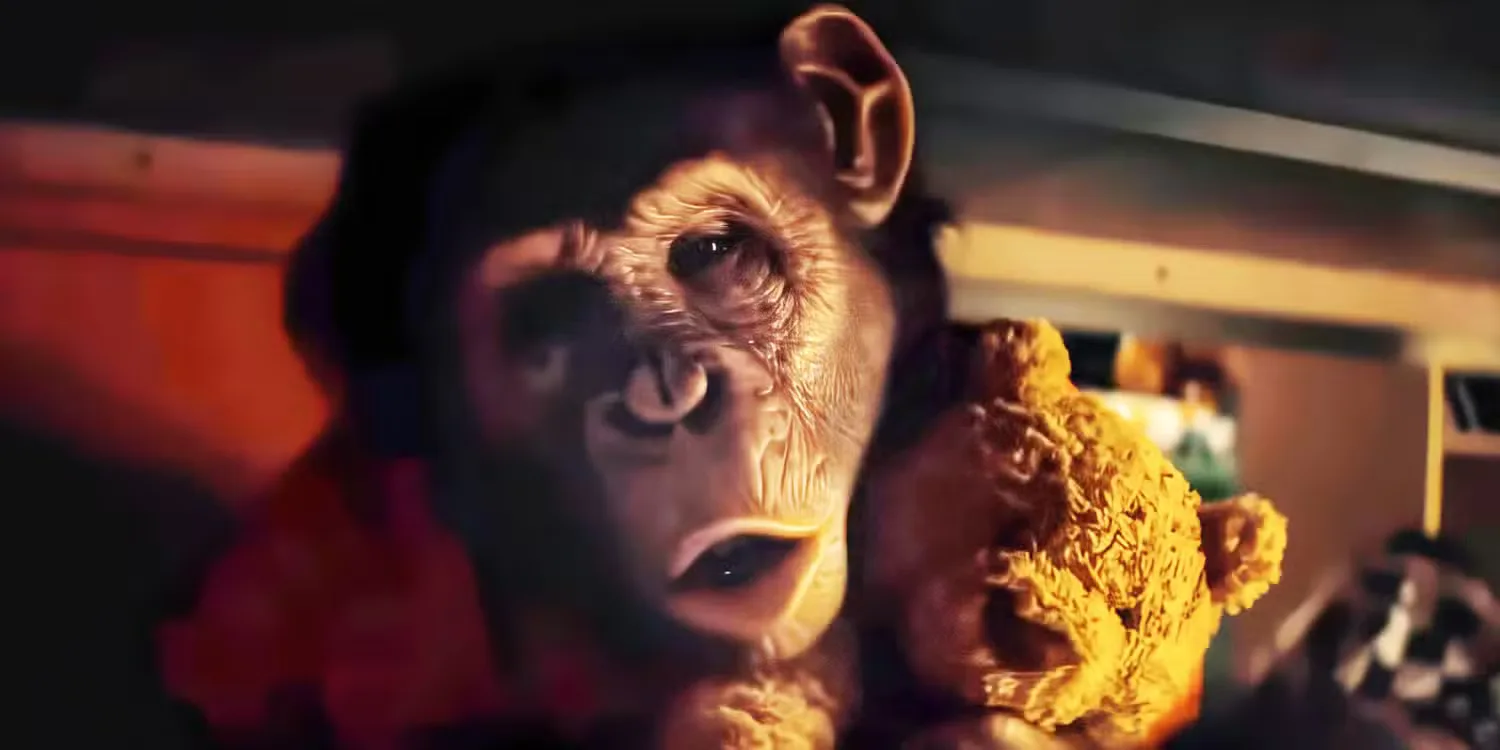 The chimpanzee in Primate holding a teddy bear. 