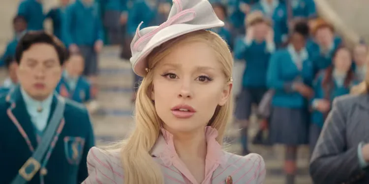 Ariana Grande as Glinda in in front of the college in Wicked: Part One.
