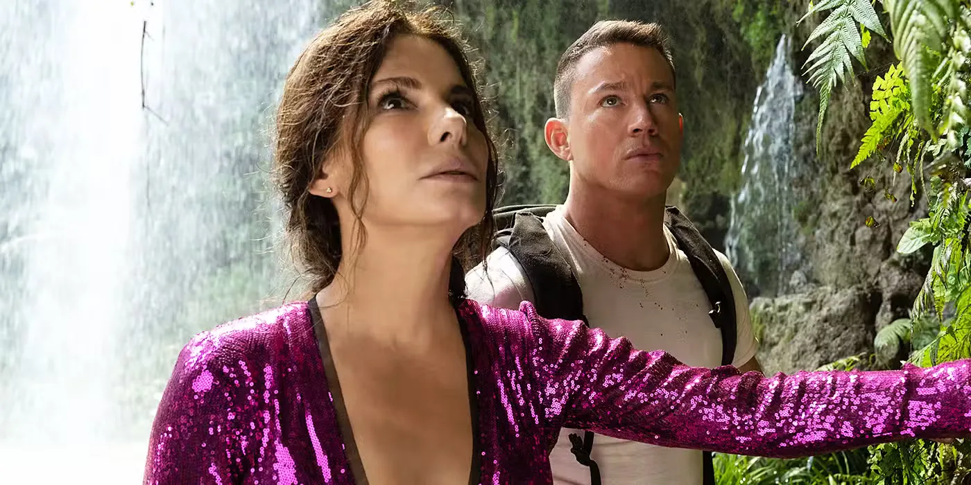 Sandra Bullock as Loretta and Channing Tatum as Alan looking up by a waterfall in The Lost City.