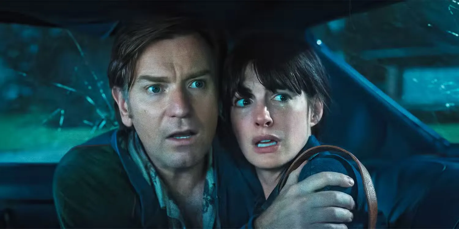 Ewan-McGregor and Anne Hathaway looking scared in The End of Oak Street