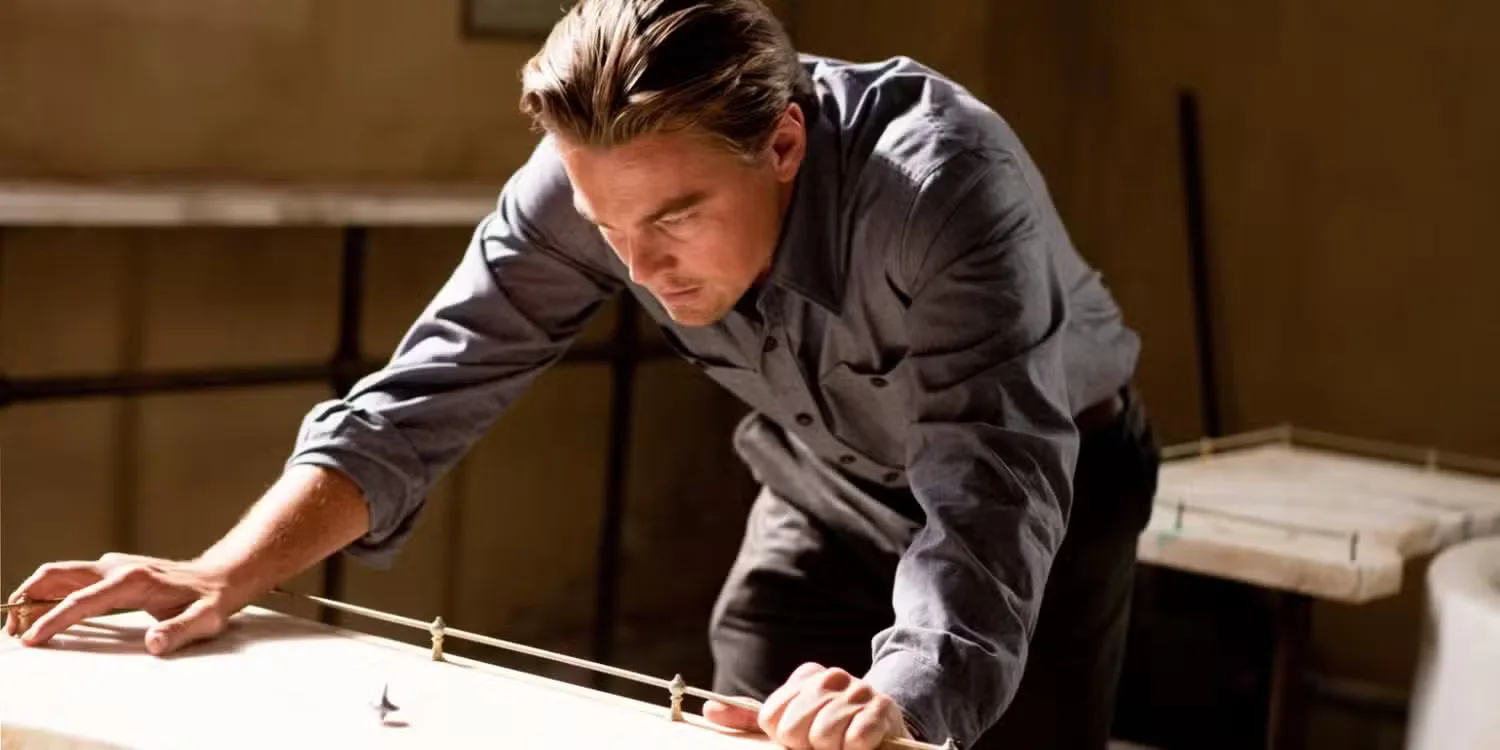 Leonardo DiCaprio looking at his spinning totem in Inception
