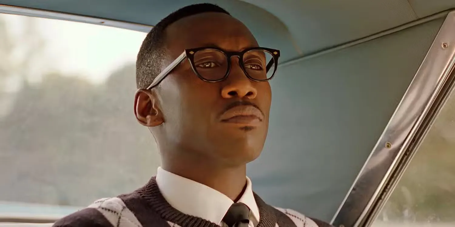 Mahershala Ali seated in the back of a car in Green Book