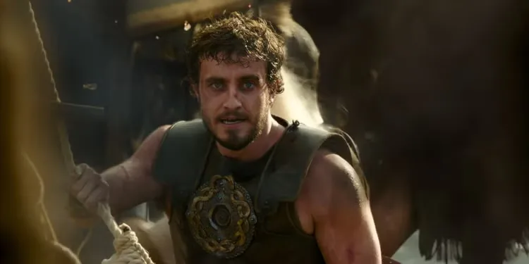 Paul Mescal as Lucius wearing Roman armor and holding a rope in Gladiator 2