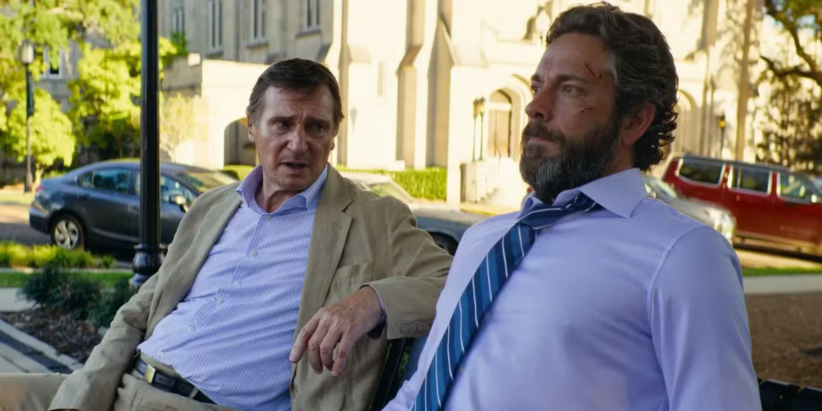 Liam Neeson and Zachary Levi in The Fix