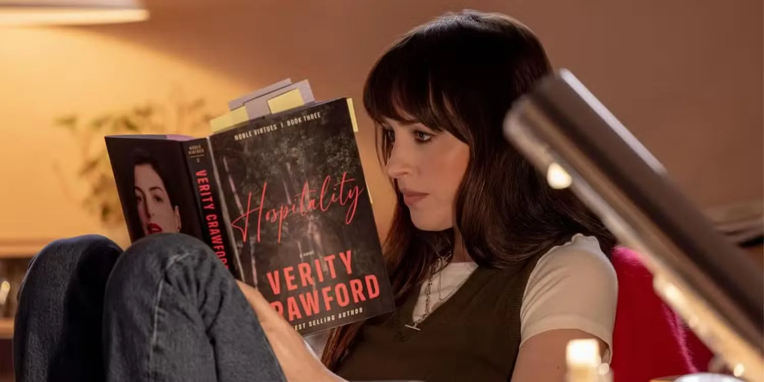 Dakota Johnson reading a book as Lowen in Verity. 