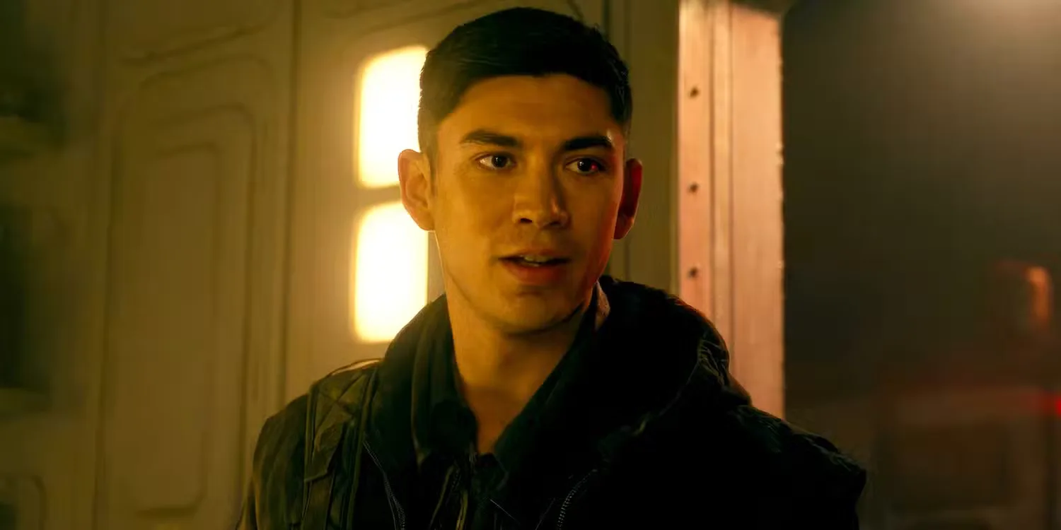 Archie Renaux stands on a space ship and looks at something off screen in Alien: Romulus
