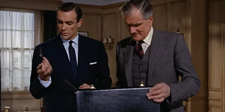 James Bond and Q looking at a black leather briefcase in From Russia With Love