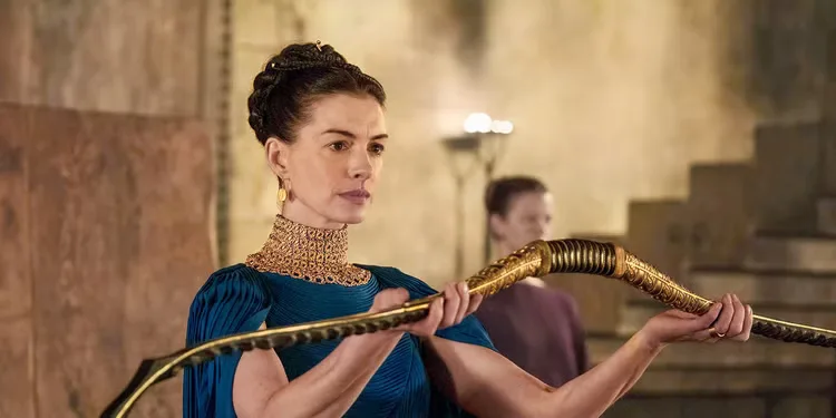Penelope holding up Odyssey's bow during the end of Christopher Nolan's The Odyssey