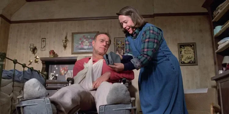 Kathy Bates tends to a wheelchair-bound James Caan in 'Misery'.