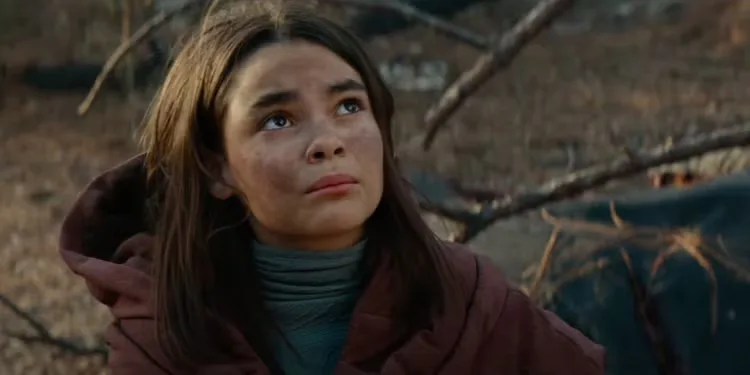 Ariana Greenblatt looking up in the movie 65