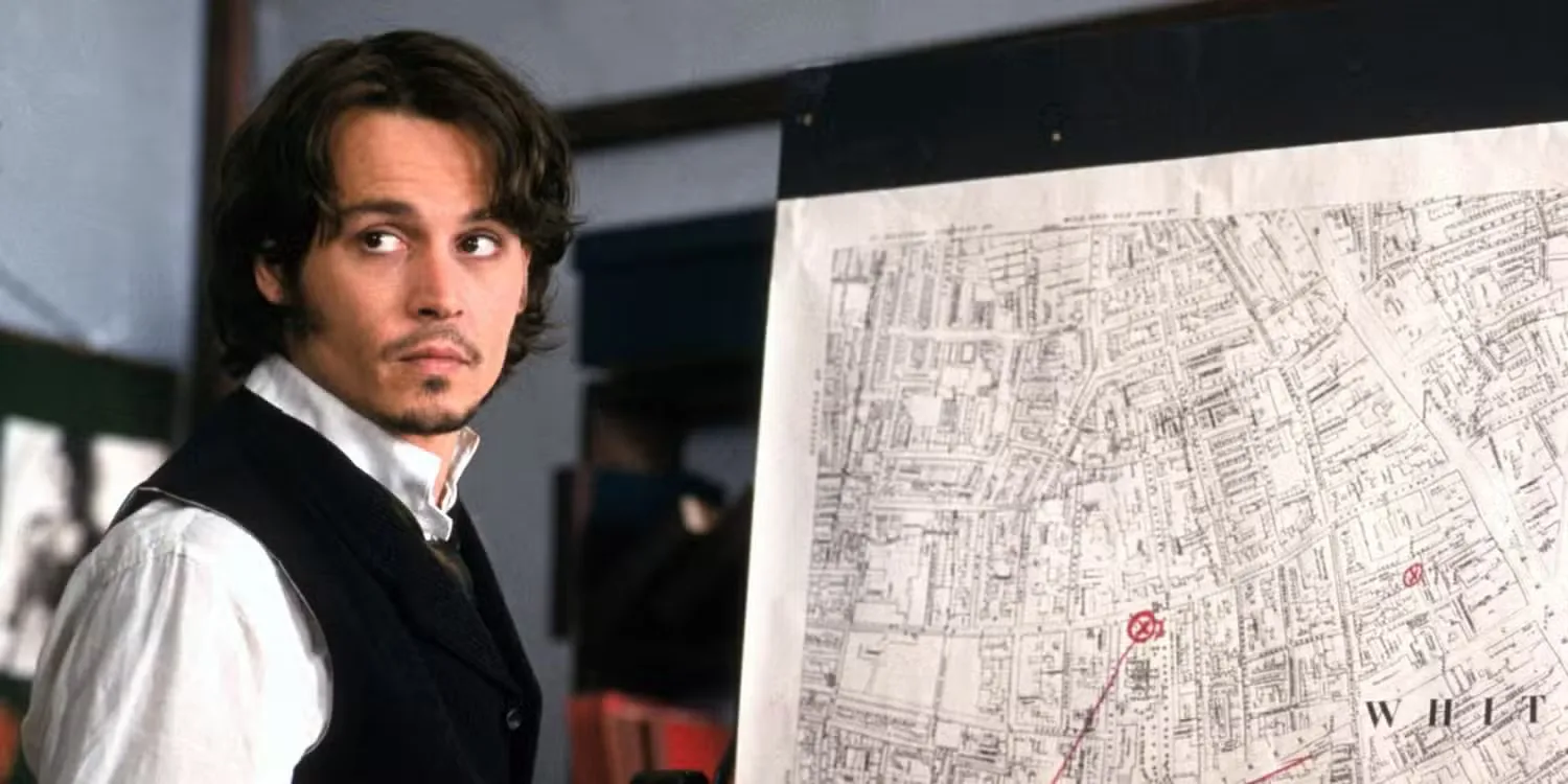 Johnny Depp in front of a map of Jack the Ripper's crimes in From Hell - 2001