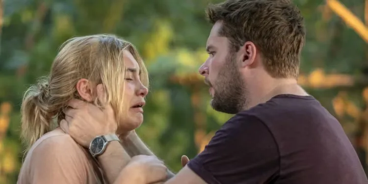 Jack Reynor holding Florence Pugh's face in his hands as she has a panic attack in 'Midsommar'