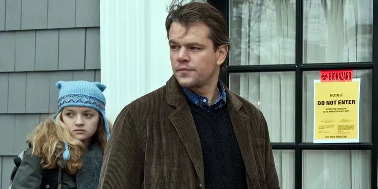 Anna Jacoby-Heron as Jory and Matt Damon as Mitch looking back at a person offscreen in Contagion