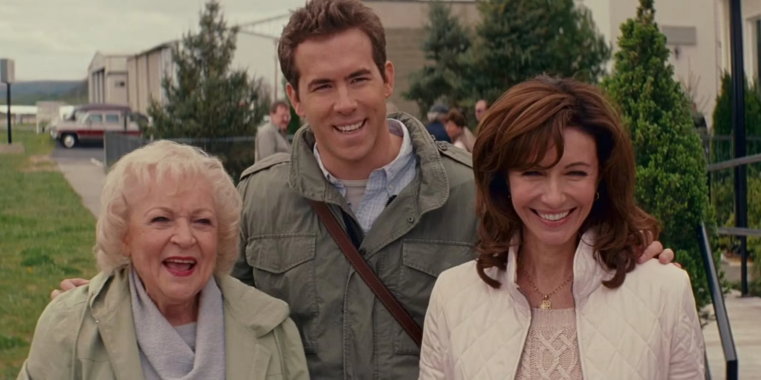 Betty White, Ryan Reynolds, and Mary Steenburgen smiling in The Proposal