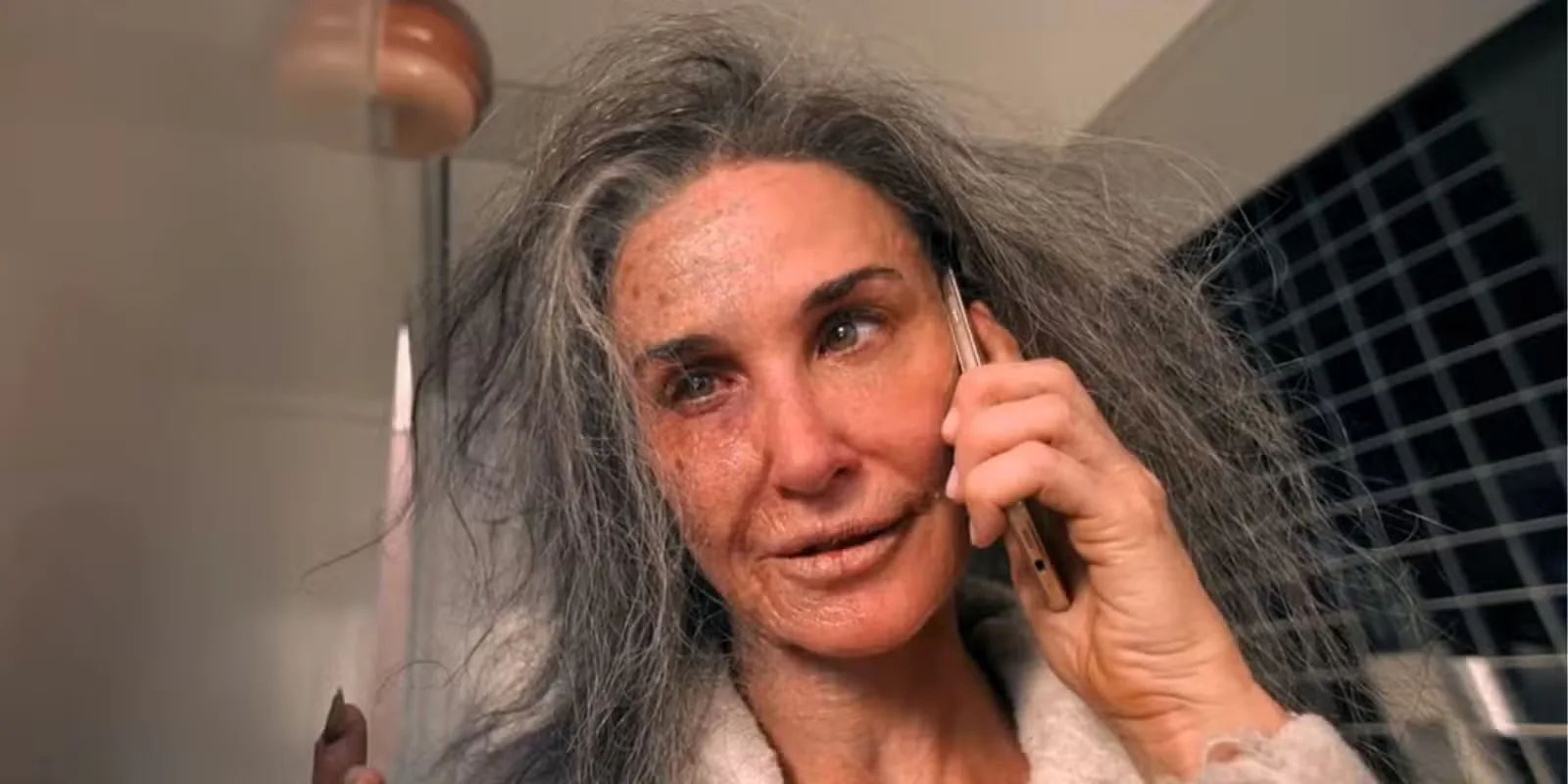 Older Elisabeth Sparkle on the phone in The Substance