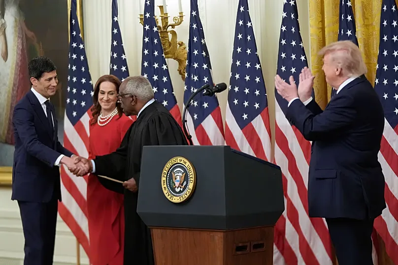 US President Donald Trump applauds Kevin Warsh, after being sworn in as Chairman of the Federal Reserve in the East Room of the White House, 22 May 2026