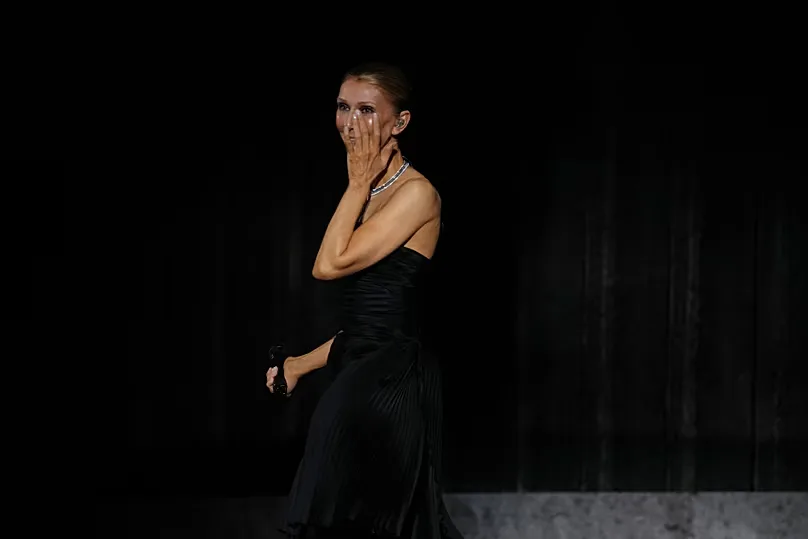 Singer Celine Dion reacts during the opening concert of her "Celine Dion Paris 2026" residency at the Plenitude Arena in Nanterre, France, outside Paris, Saturday, Sept. 12.