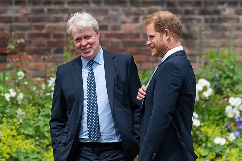 Britain's Prince Harry speaks with his uncle Earl Spencer at Kensington Palace, 1 July, 2021