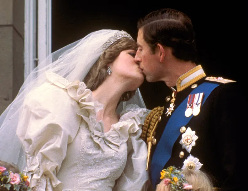 Britain's Prince Charles kisses his bride, the former Diana Spencer, on the balcony of Buckingham Palace in London, 29 July, 1981