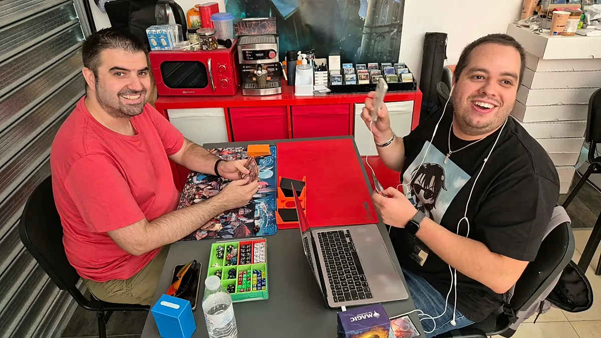Cristian, with a friend, playing a game of 'Magic: The Gathering'