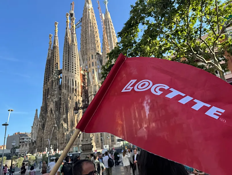 Henkel Loctite flag in front of the Sagrada Familia