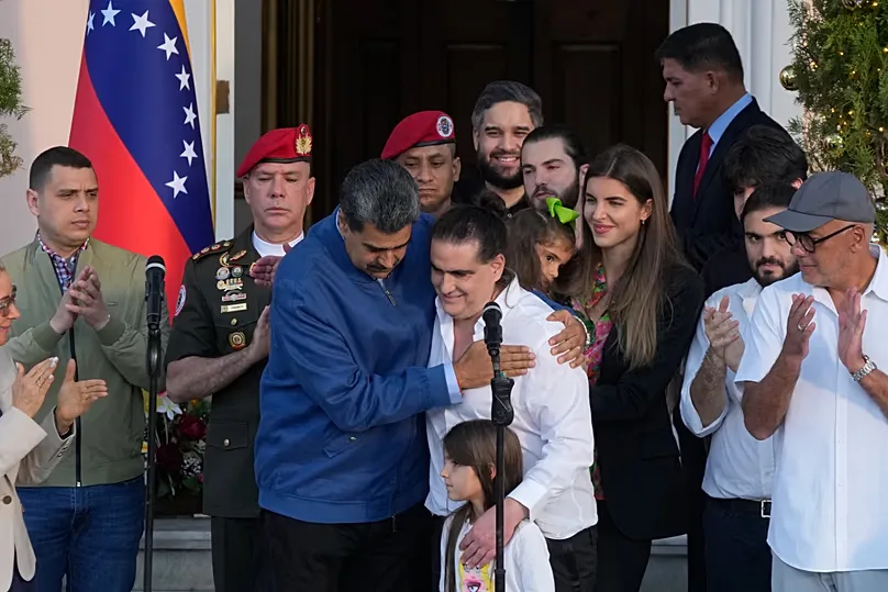 Venezuelan President Maduro, center left, embraces Alex Saab after Saab arrived at Miraflores presidential palace in Caracas, Venezuela, Wednesday, Dec. 20, 2023.