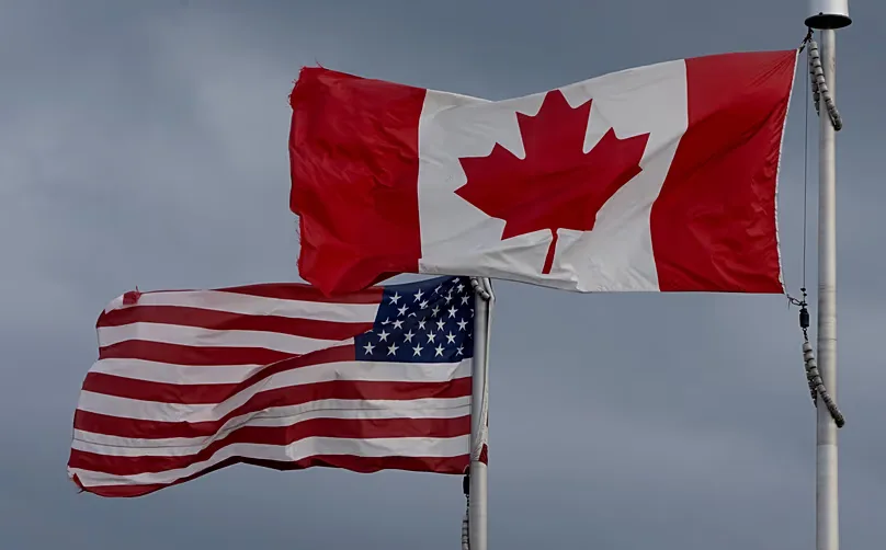 The flags of Canada and the United States fly over a stadium in Ottawa, Saturday, Sept. 12, 2026.