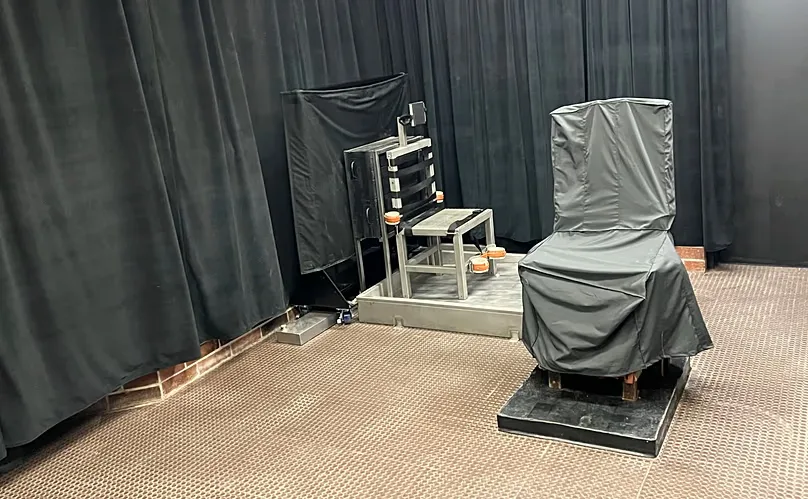 FILE - Display of the state's death chamber in Columbia, South Carolina, including the electric chair, right, and a firing squad chair, left.
