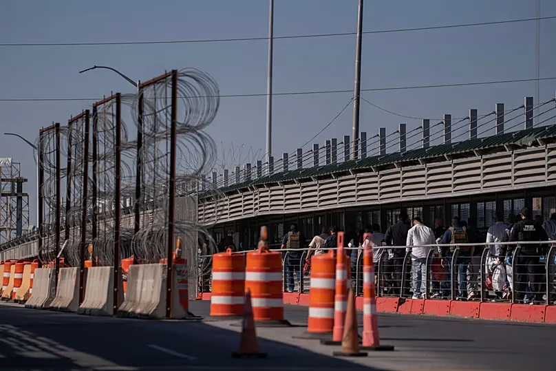 A group of undocumented migrants is deported by ICE agents across the McAllen–Hidalgo–Reynosa International Bridge in McAllen, 13 March, 2026