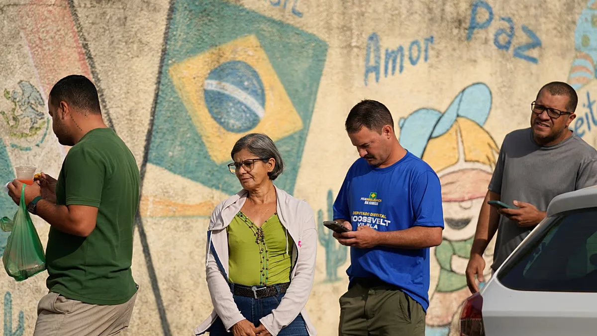 Voters queue at a polling station during the general election in Brasília, Brasília, on Sunday, 4 October 2026.
