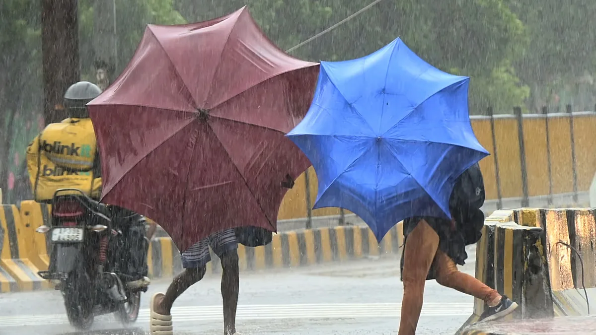 People use umbrellas to shield themselves from strong winds as Cyclone Arnab approaches the Andhra Pradesh coast, in Visakhapatnam, India, Tuesday, Oct. 27, 2026. 