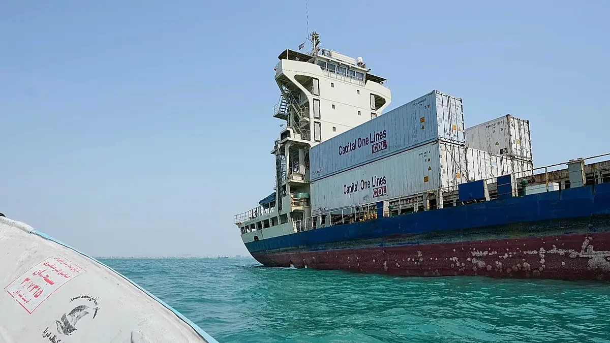 A cargo vessel carrying shipping containers lies anchored in the Strait of Hormuz off Bandar Abbas, Iran, Sunday, Sept. 6, 2026.