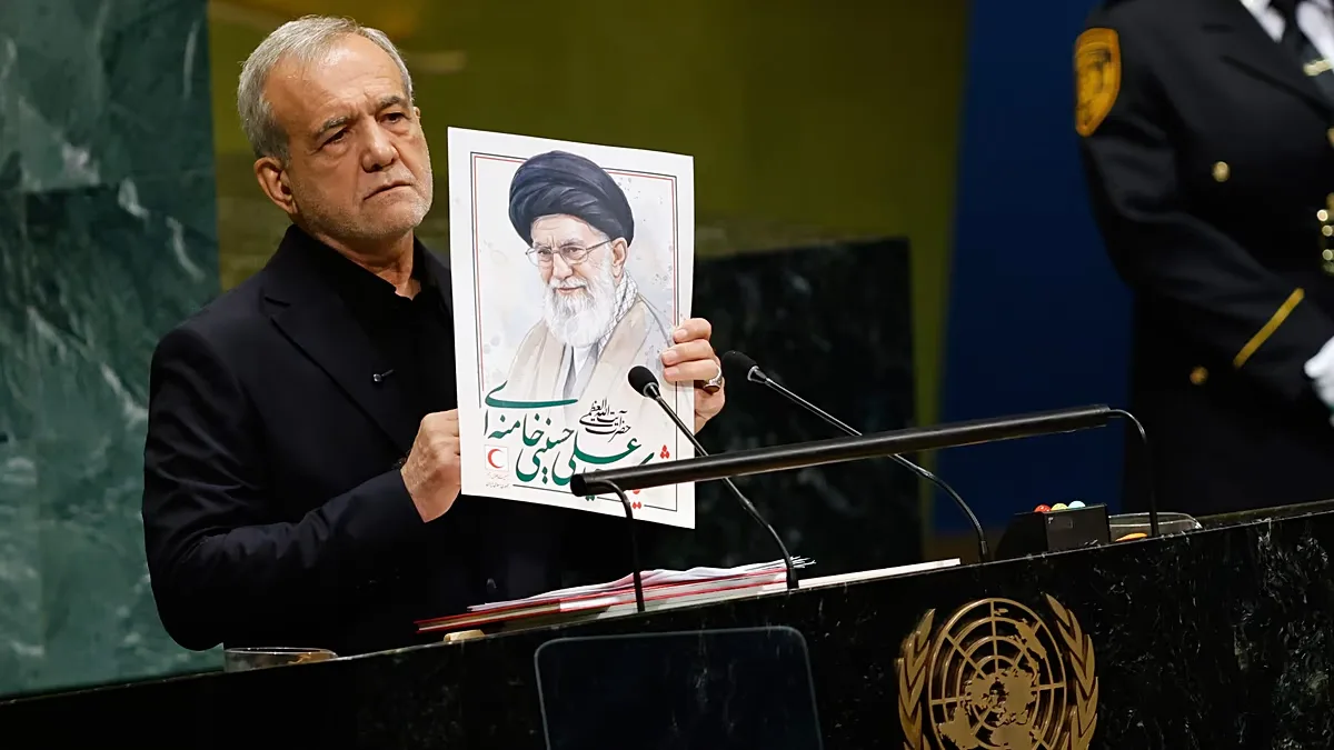Iran's President Masoud Pezeshkian holds an image of late Ayatollah Ali Khamenei during the 81st session of the General Assembly at UN headquarters, 23 September 2026