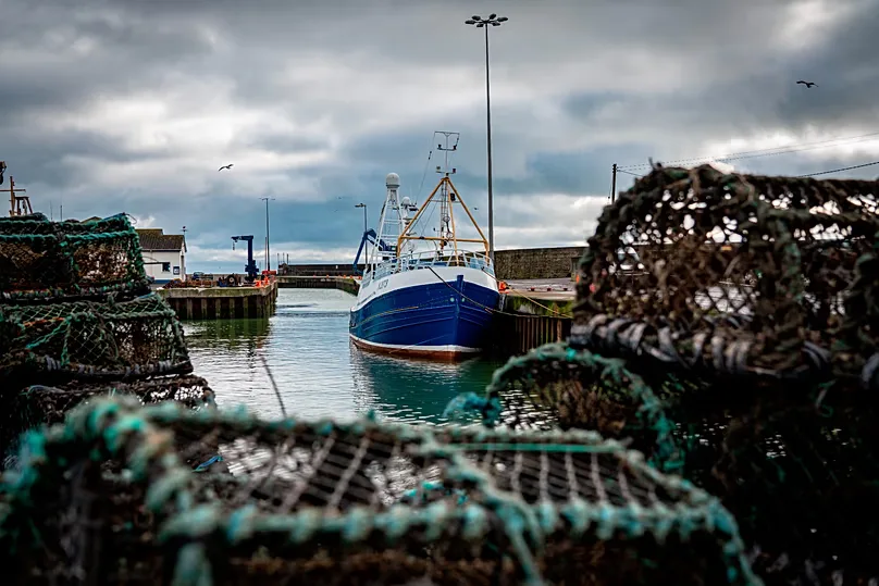 A fishing vessel is docked at Kilkeel harbor in Northern Ireland. 