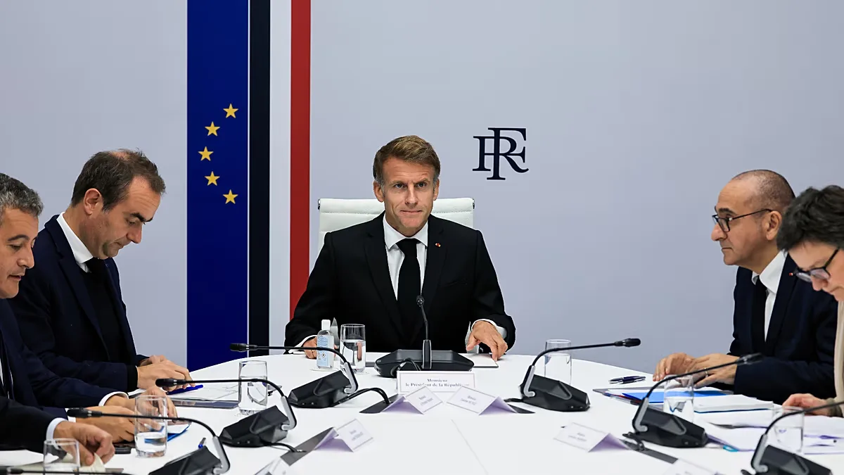France's President Emmanuel Macron, center, hosts an Interministerial Crisis Meeting at the Elysee Presidential Palace, in Paris, on Sunday, 18 October 2026.
