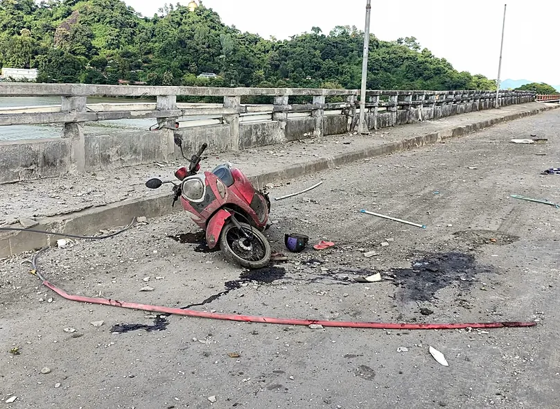 A damaged motorcycle seen on a bridge after a market in an adjacent area was allegedly hit by the military’s airstrike in Kyauktaw, Rakhine, Myanmar, Monday, Sept.28, 2026