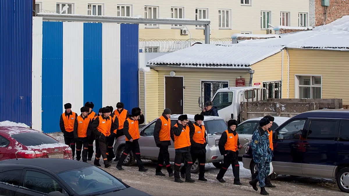 FILE: Prisoners under escort leave prison to work at a prison colony in Krasnoyarsk, 20 December 2013