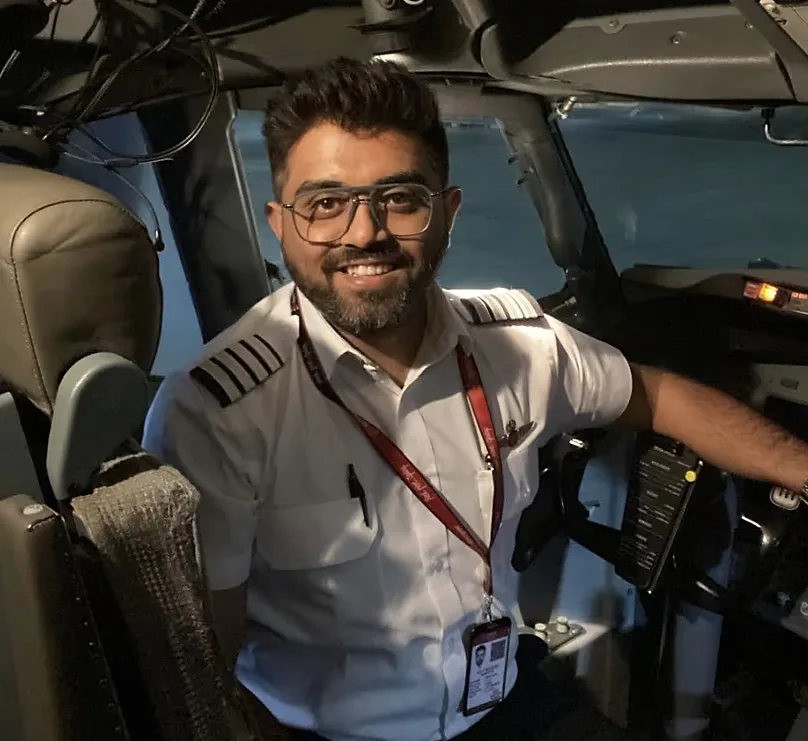 This undated photo released on Israel's Foreign Ministry social media shows Indian Captain Smit Machchhar in the cockpit of a plane in an unknown location