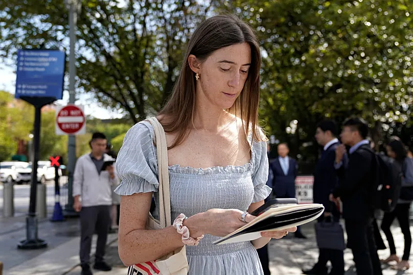 Politico White House reporter Cheyenne Haslett is pictured near the White House complex after having her credential revoked, Saturday, Sept. 19, 2026, in Washington