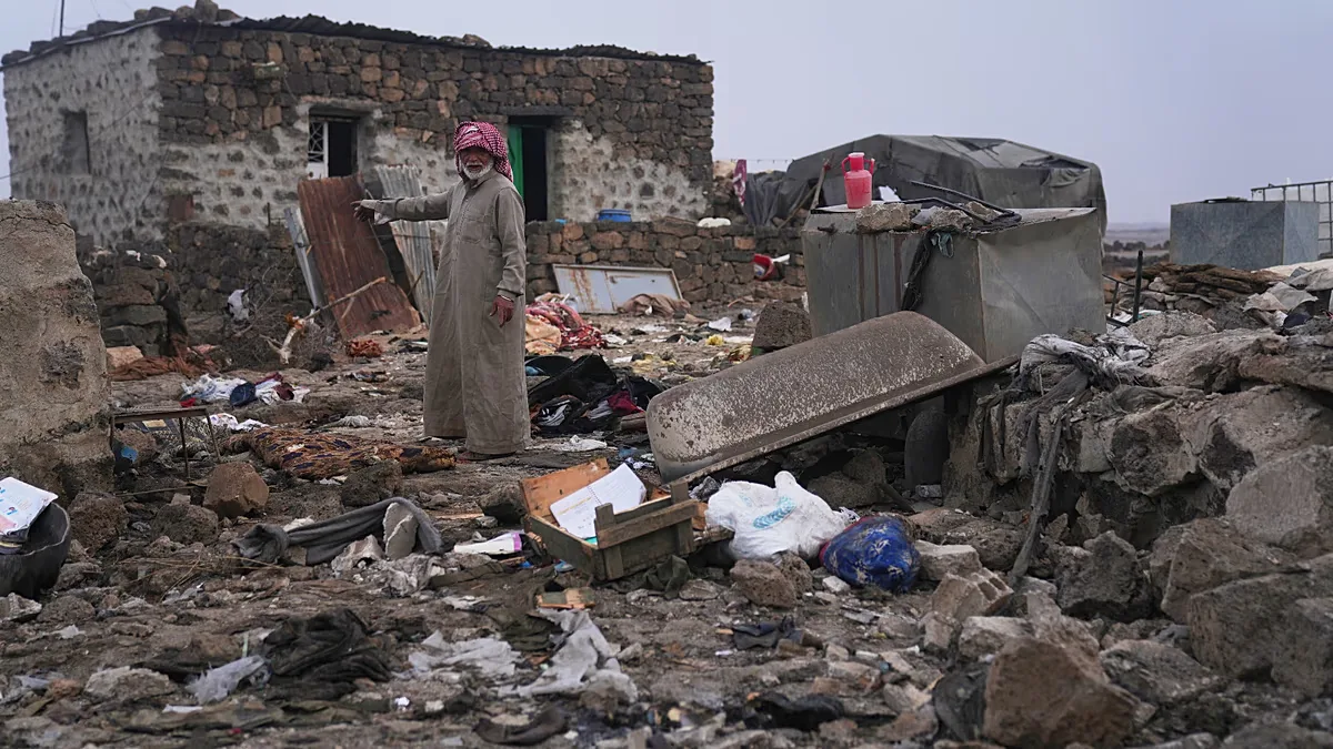 A man inspects the aftermath of a Jordanian airstrike in Al-Tuff, in the countryside of Daraa province in southern Syria, Tuesday, Oct. 27, 2026.