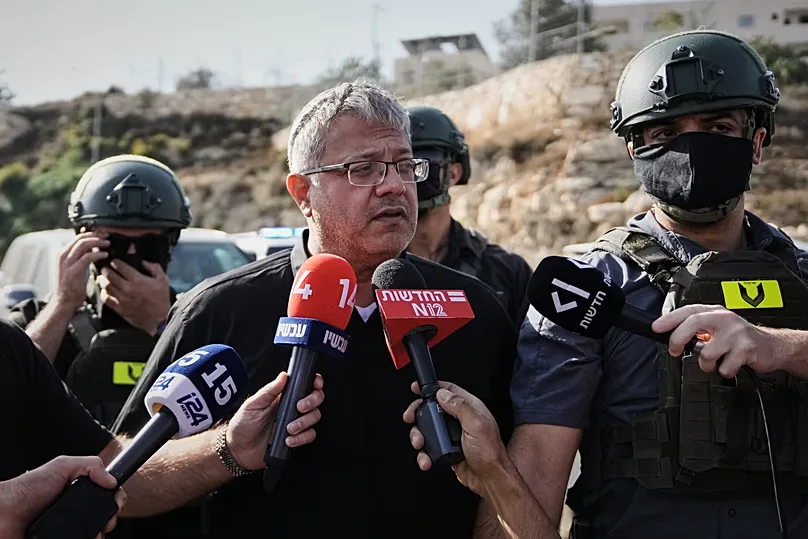 Israeli National Security Minister Itamar Ben-Gvir speaks to the media at the scene of a shooting near Hebron