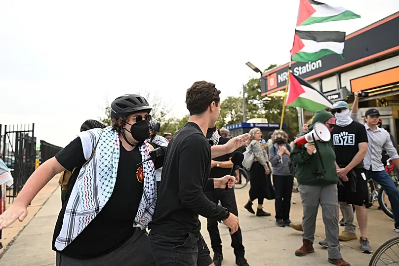 Pro Palestinian protesters, right, march past counter protesters during a protest before an Ed Sheeran concert in Philadelphia, Saturday, Sept. 19, 2026