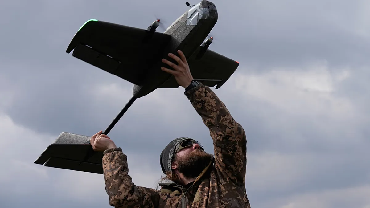 March 19, 2026, a student soldier of the Yatagan School for Unmanned Aerial Systems launches a drone during drills in the Kyiv region, Ukraine.
