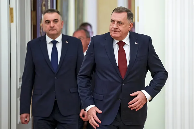 Bosnian Serb leader Milorad Dodik, right, and Prime Minister of Republika Srpska Savo Minic enter a hall for the talks with Russian President Vladimir Putin at the Kremlin.
