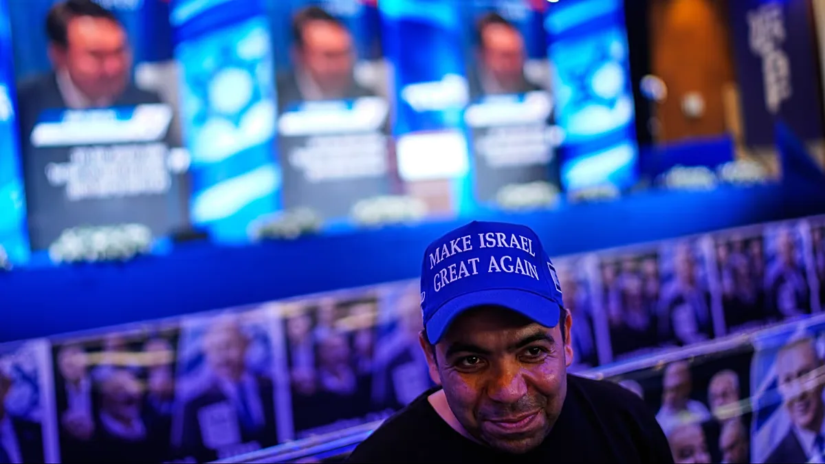Supporters of Israeli Prime Minister Benjamin Netanyahu celebrate at Likud party headquarters in Jerusalem following the release of the first exit poll on 28 October, 2026. 