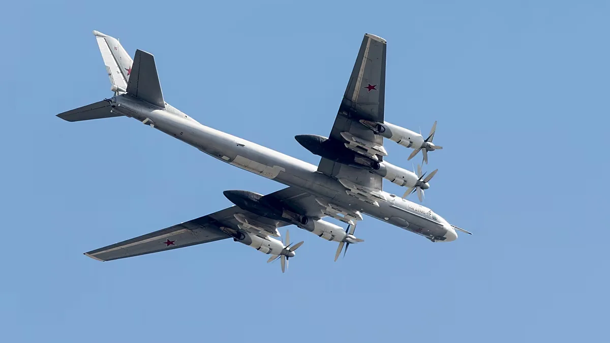 FILE: Russian Tu-95 strategic bomber flies over Red Square during the general rehearsal for the Victory Day military parade, 7 May 2015