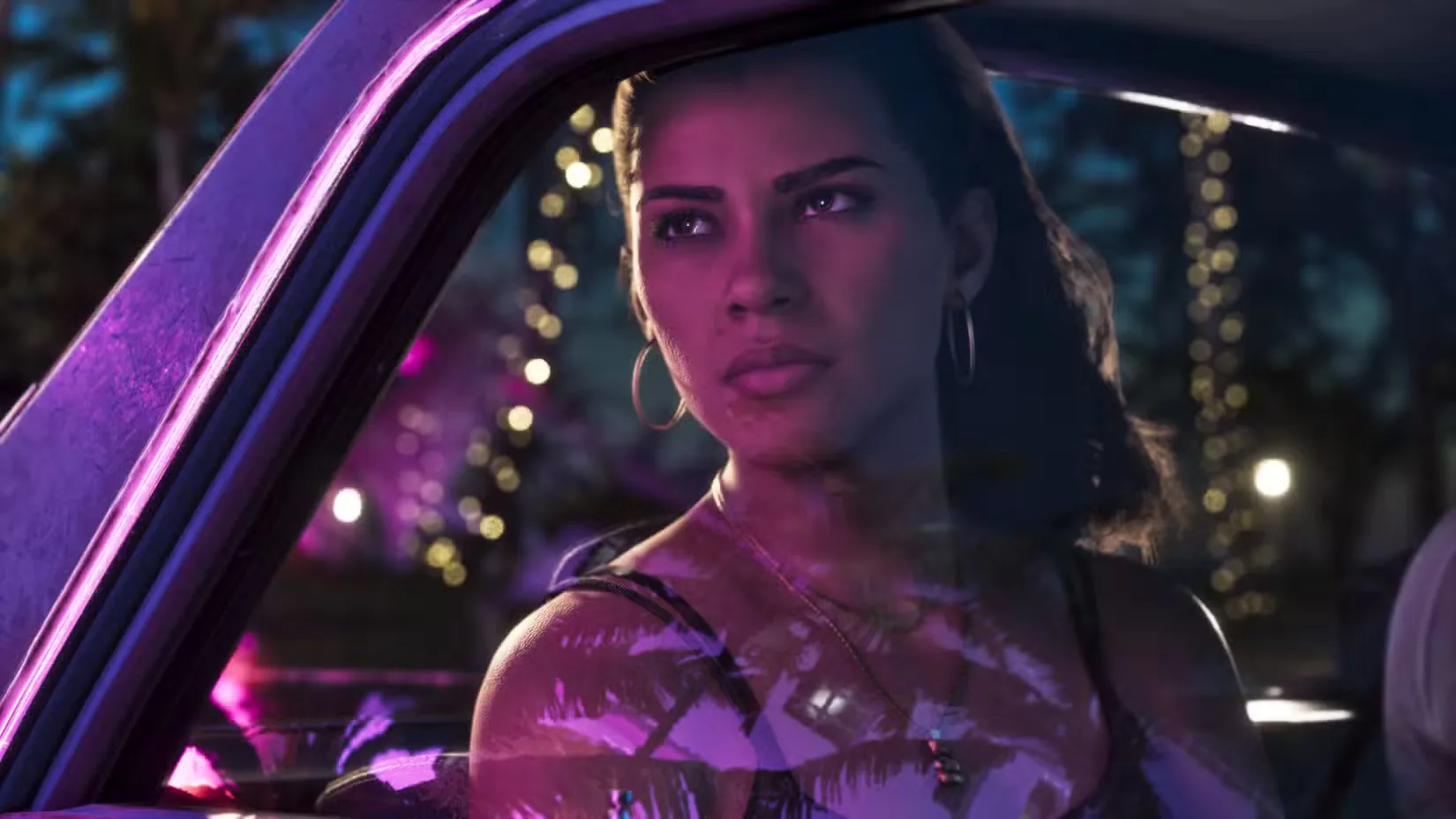 Lucia stares out of a car window